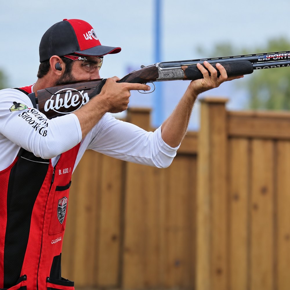 Brad Kidd Jr. aiming his shotgun during competition